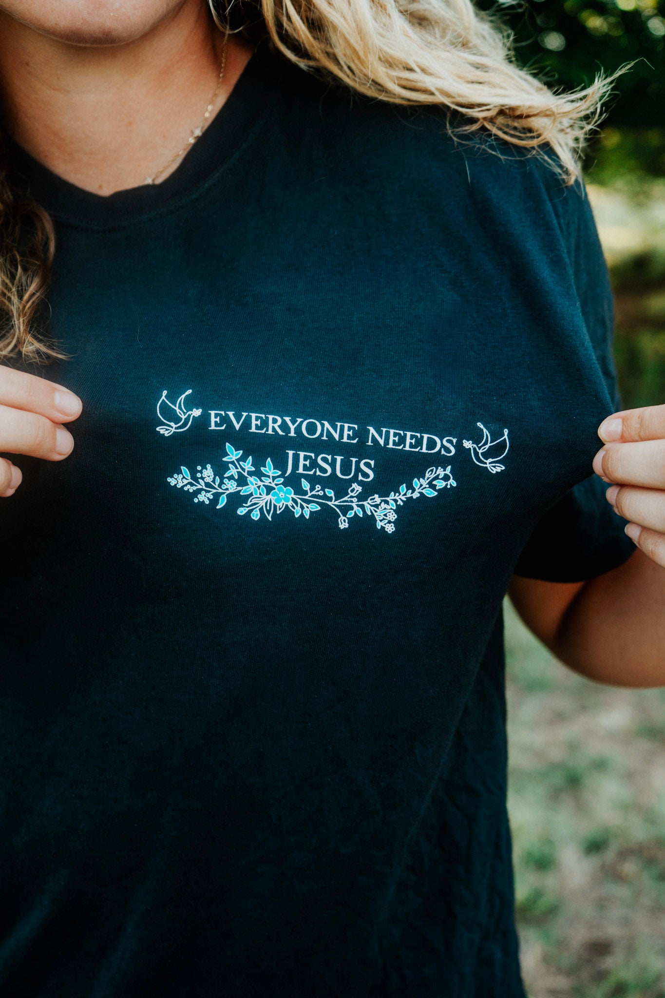 Flowered Light Blue Everyone Needs Jesus T-Shirt